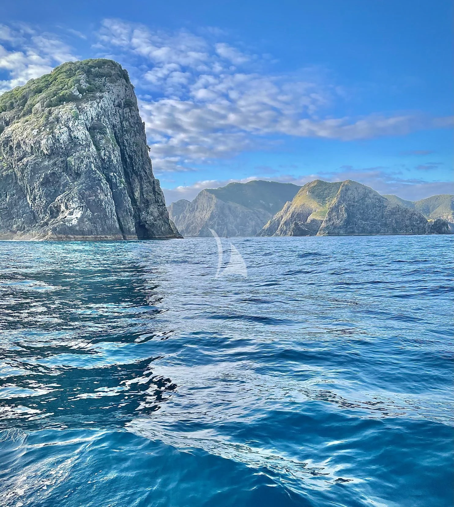 a body of water with a rock formation in the distance aboard THE BEAST Yacht for Sale