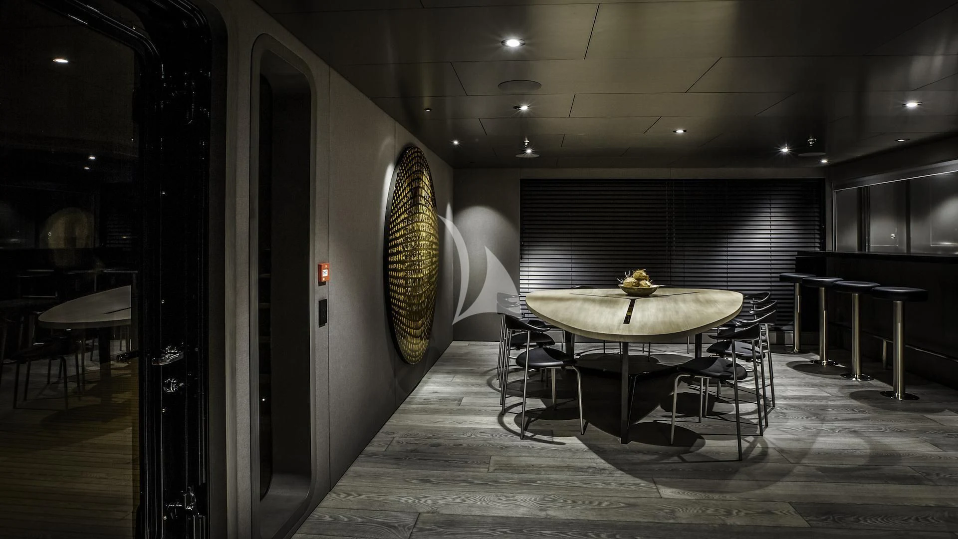 a room with a table and chairs aboard THE BEAST Yacht for Sale