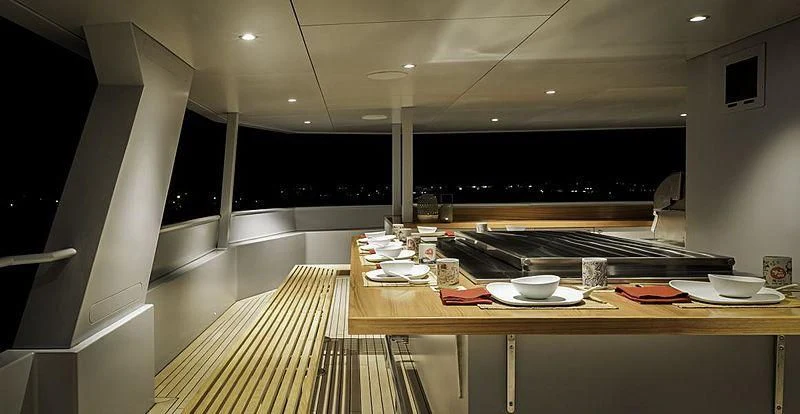 a kitchen with a large island aboard THE BEAST Yacht for Sale