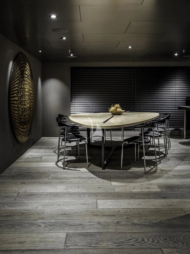 a room with a table and chairs aboard THE BEAST Yacht for Sale