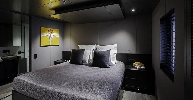 a bed in a room aboard THE BEAST Yacht for Sale