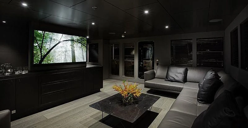 a living room with a couch and a coffee table aboard THE BEAST Yacht for Sale