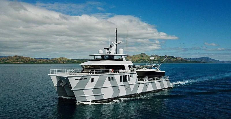 a white boat on the water aboard THE BEAST Yacht for Sale