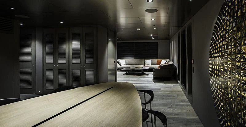 a room with a bed and a couch aboard THE BEAST Yacht for Sale