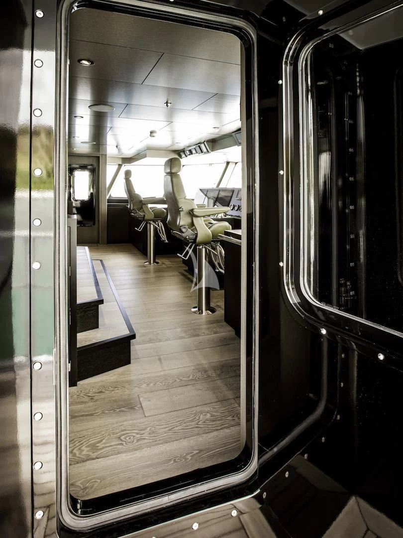 a hallway with a row of chairs aboard THE BEAST Yacht for Sale