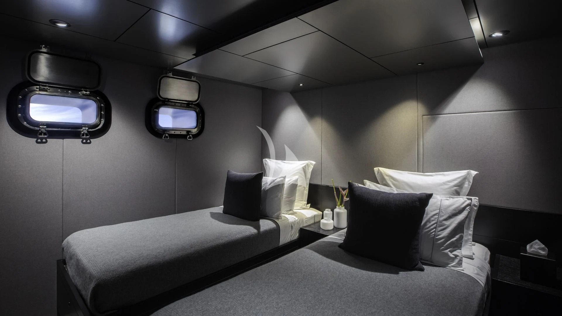 a room with two beds aboard THE BEAST Yacht for Sale