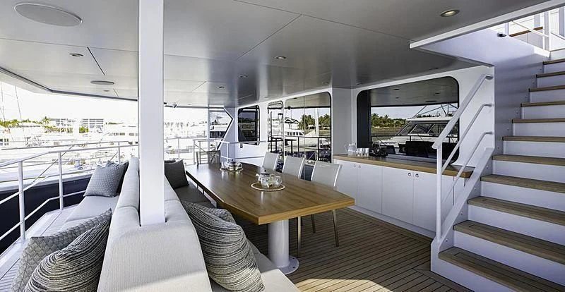 a room with a table and chairs aboard THE BEAST Yacht for Sale