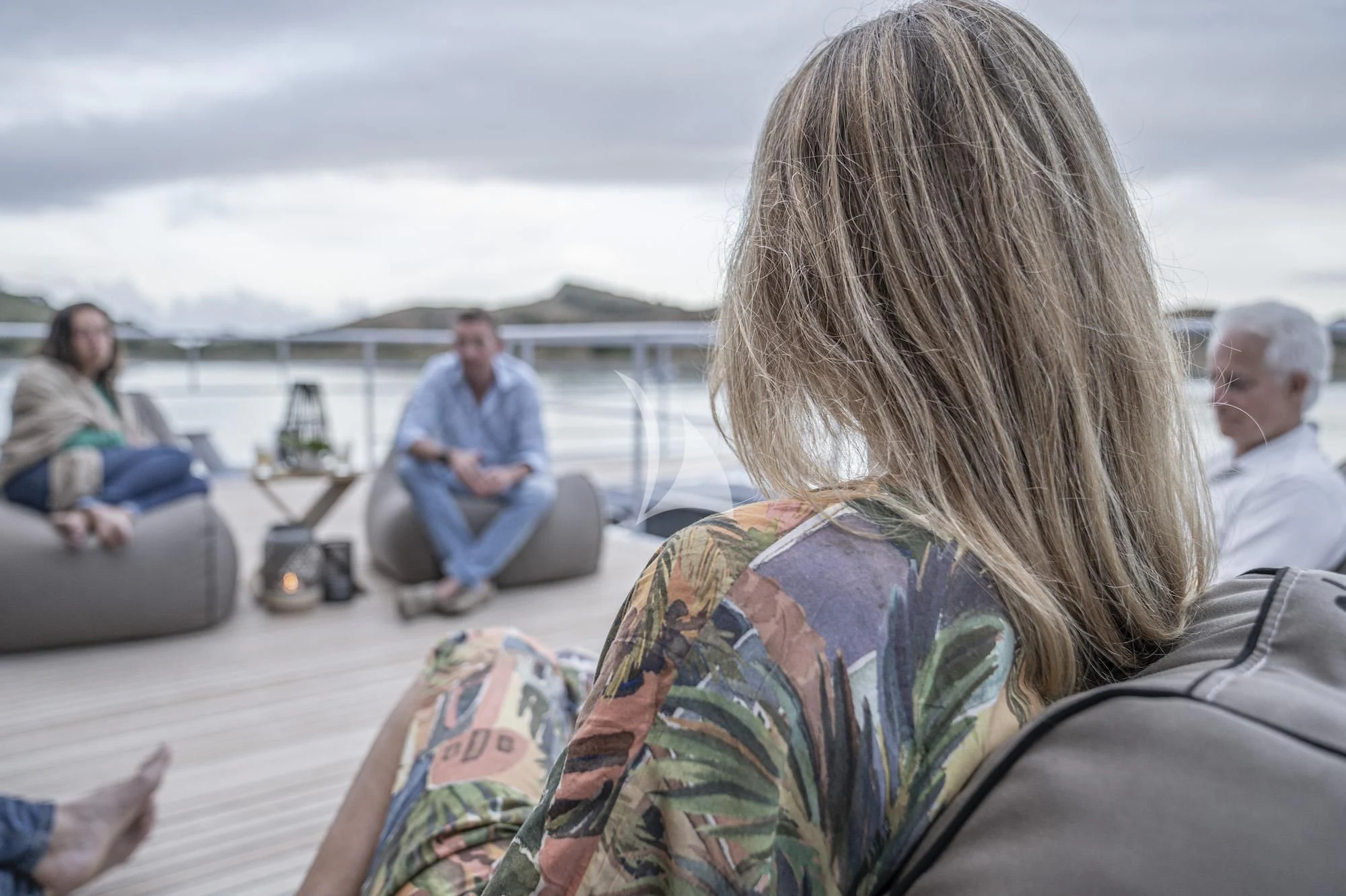 a woman sitting on a boat aboard THE BEAST Yacht for Sale