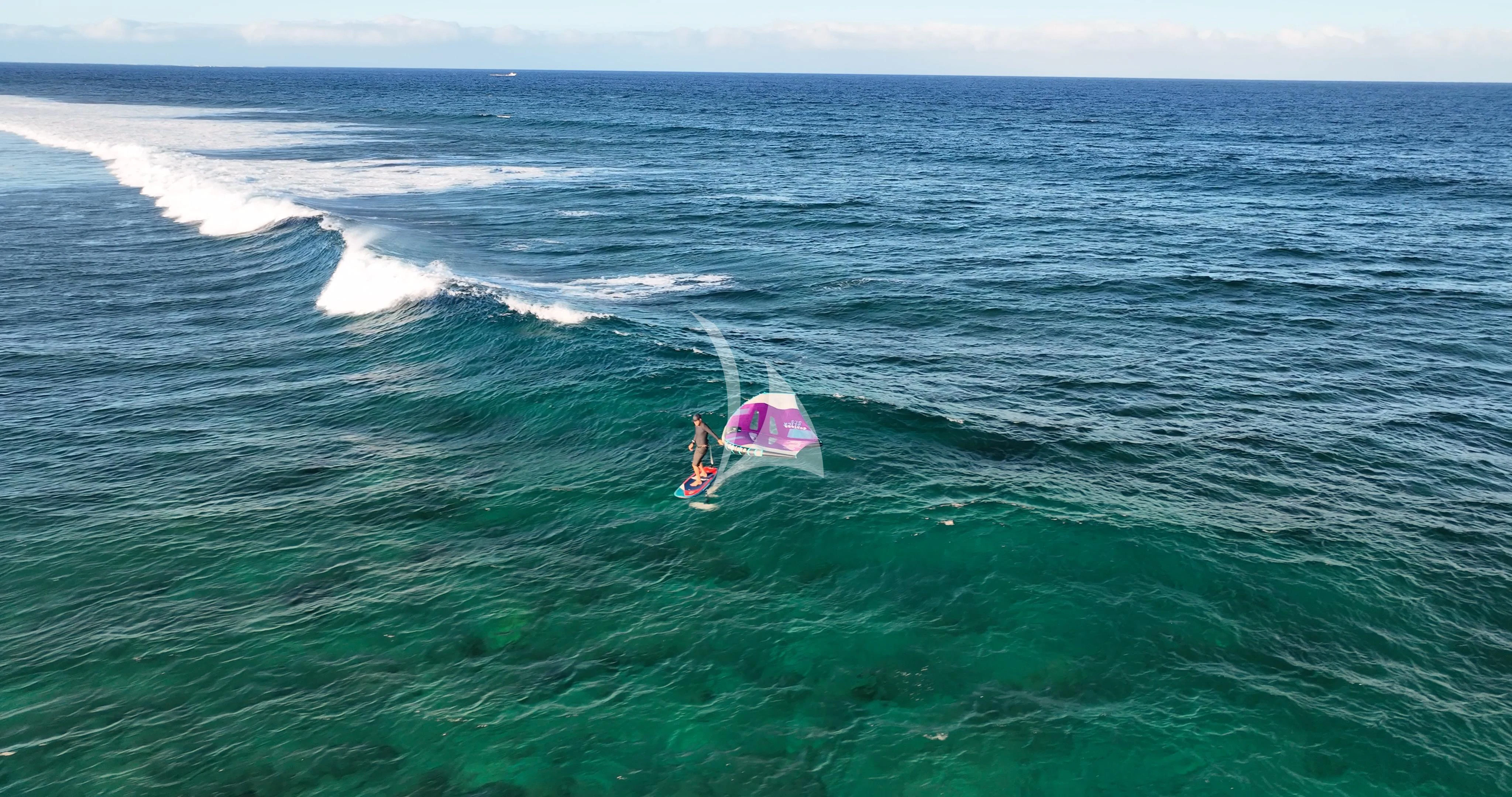 a person parasailing in the ocean aboard THE BEAST Yacht for Sale