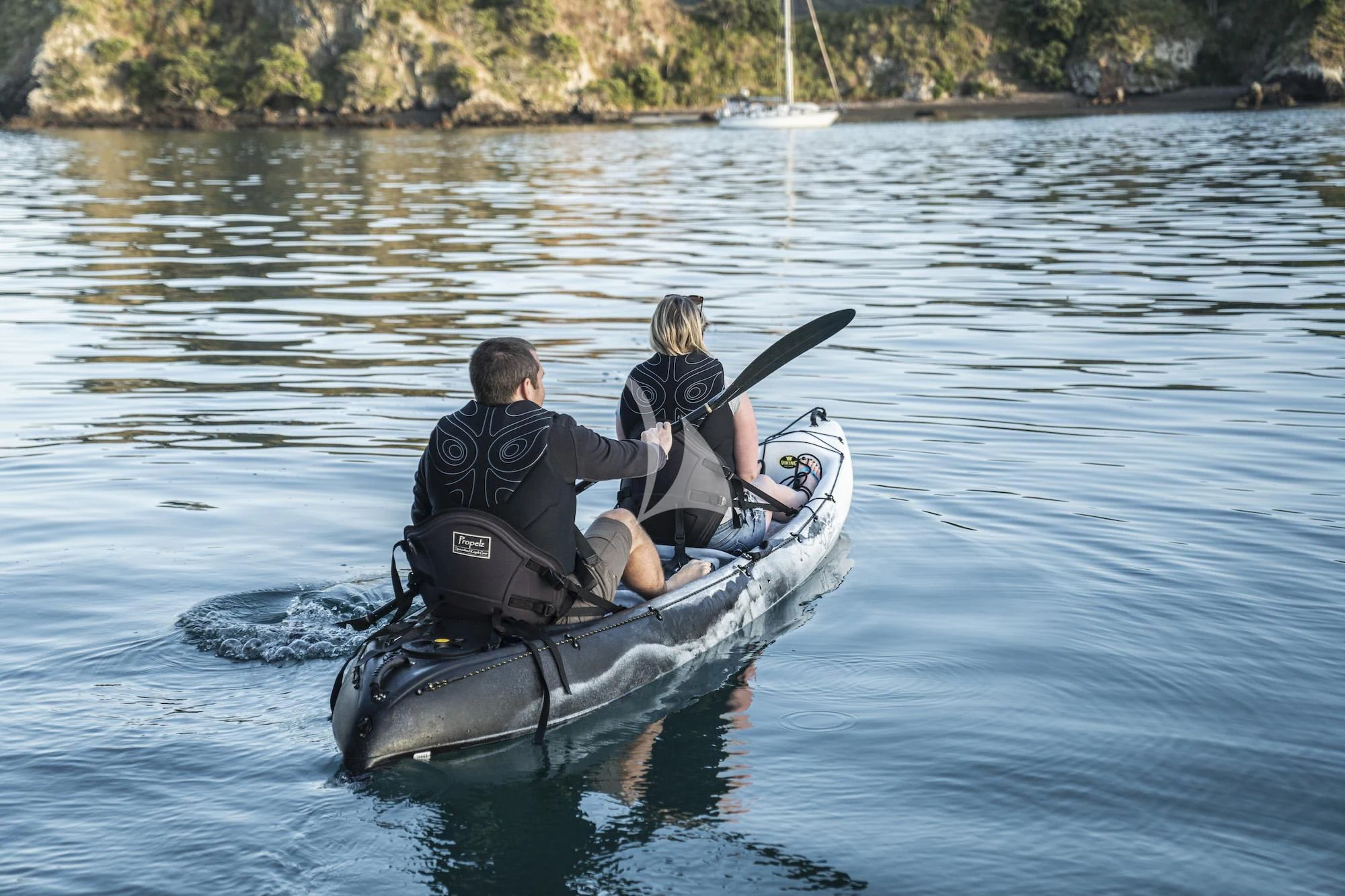 a man and woman in a boat aboard THE BEAST Yacht for Sale