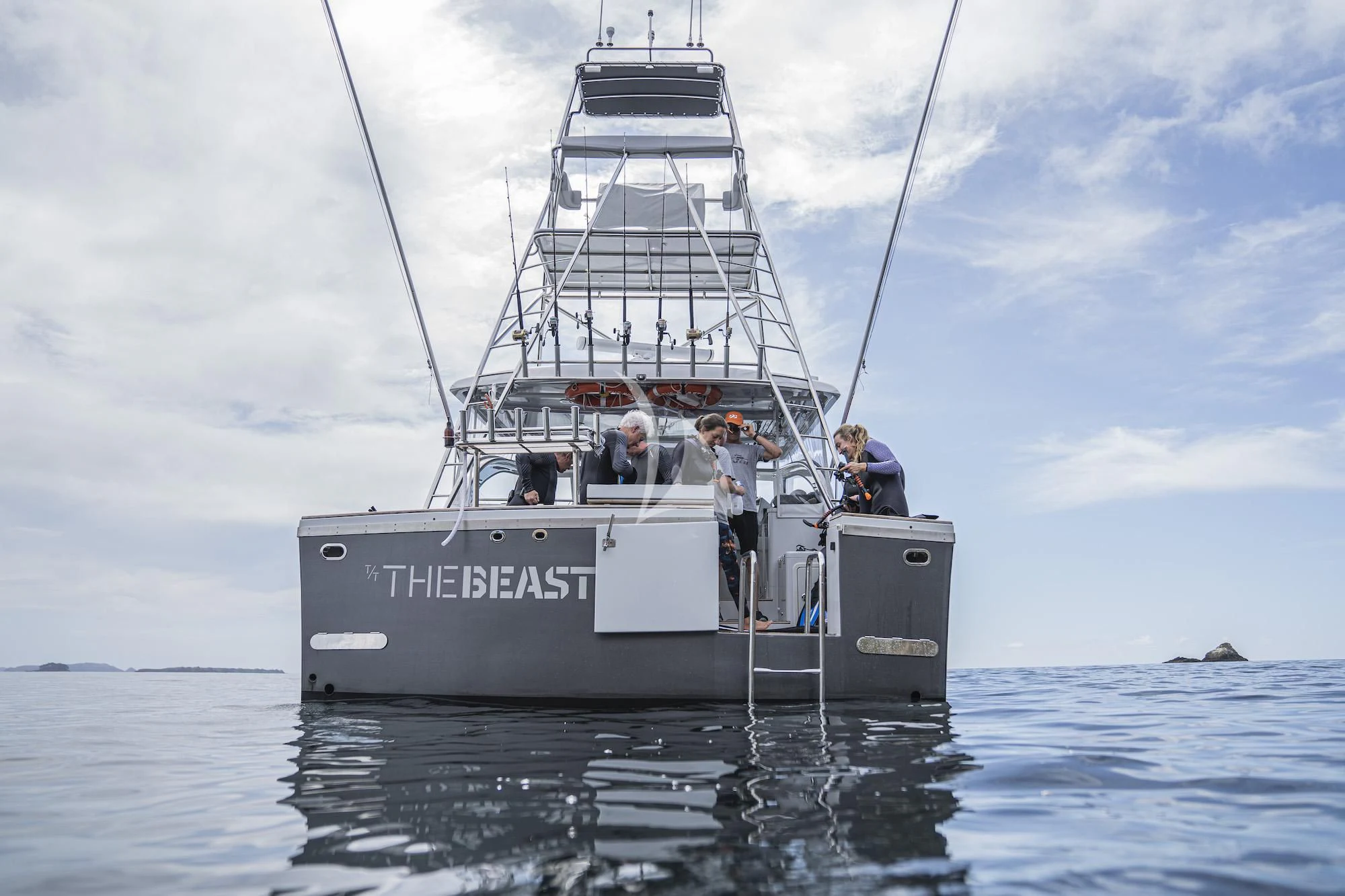 a group of people on a boat aboard THE BEAST Yacht for Sale