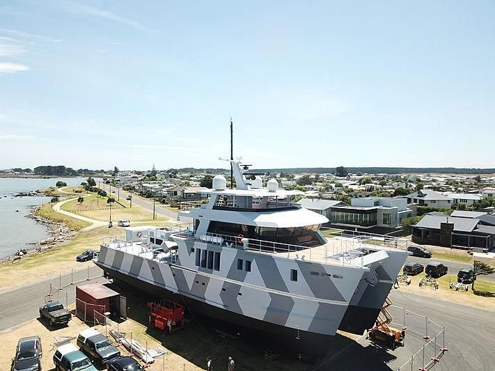 a large white boat docked aboard THE BEAST Yacht for Sale