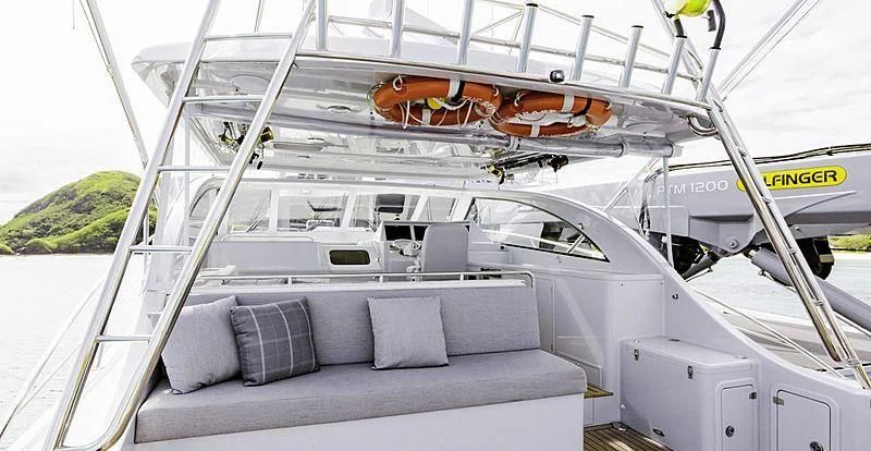 a boat with a couch aboard THE BEAST Yacht for Sale