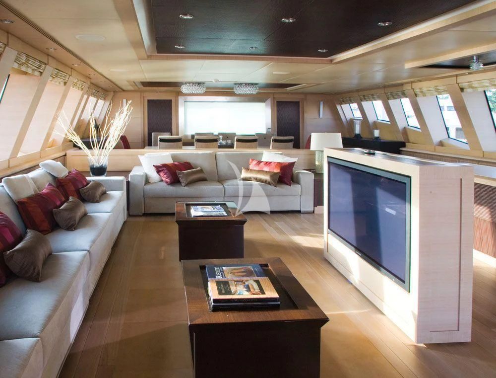 a living room with a large screen aboard WAVERUNNER Yacht for Sale