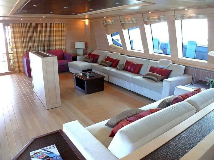 a living room with a couch and a table aboard WAVERUNNER Yacht for Sale