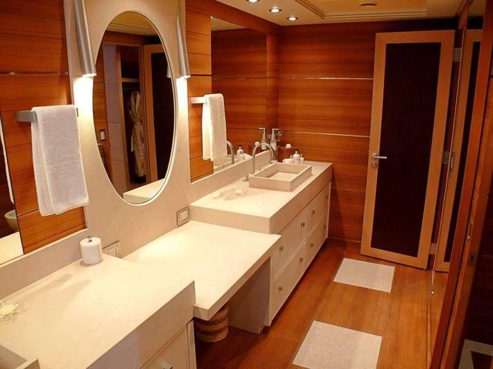 a bathroom with a large mirror aboard WAVERUNNER Yacht for Sale