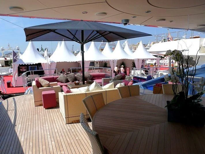 a large tent with tables and chairs aboard WAVERUNNER Yacht for Sale
