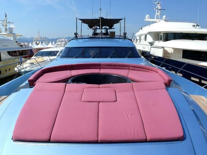 a pink boat in a harbor aboard WAVERUNNER Yacht for Sale