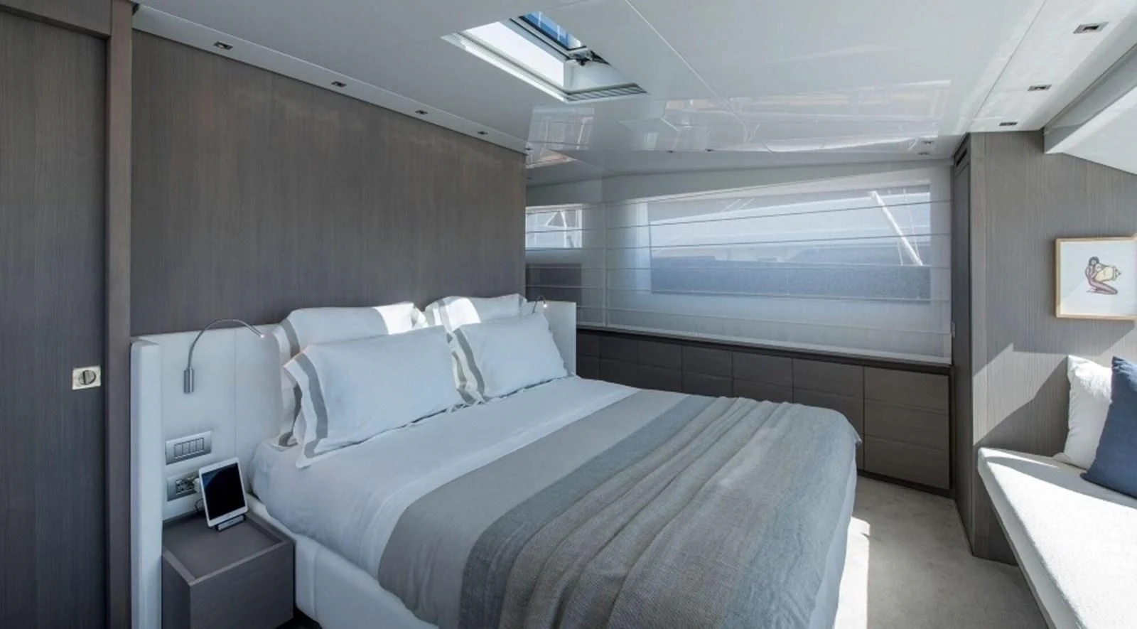 a room with a bed and a couch aboard DINAIA Yacht for Charter