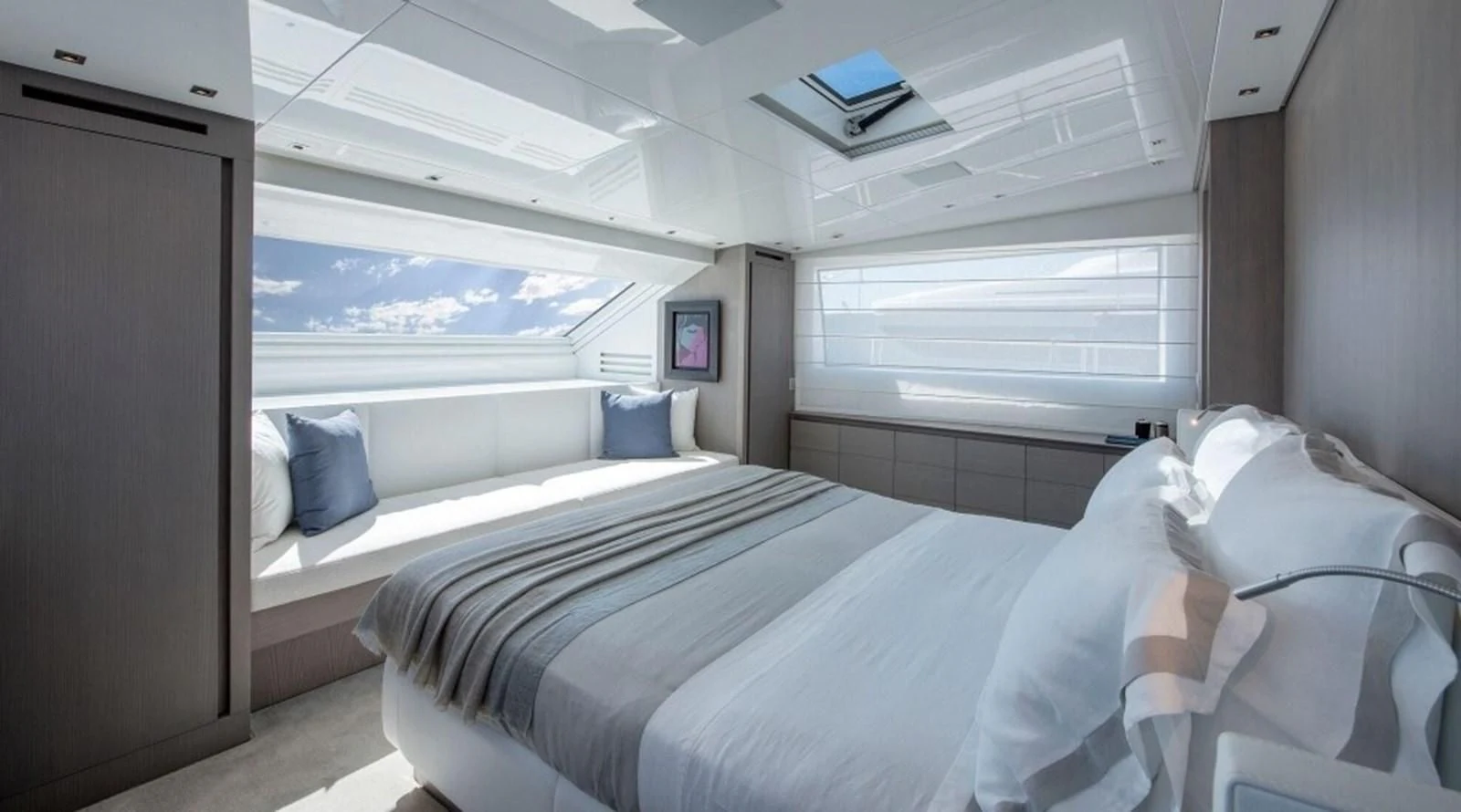 a room with beds and a television aboard DINAIA Yacht for Charter