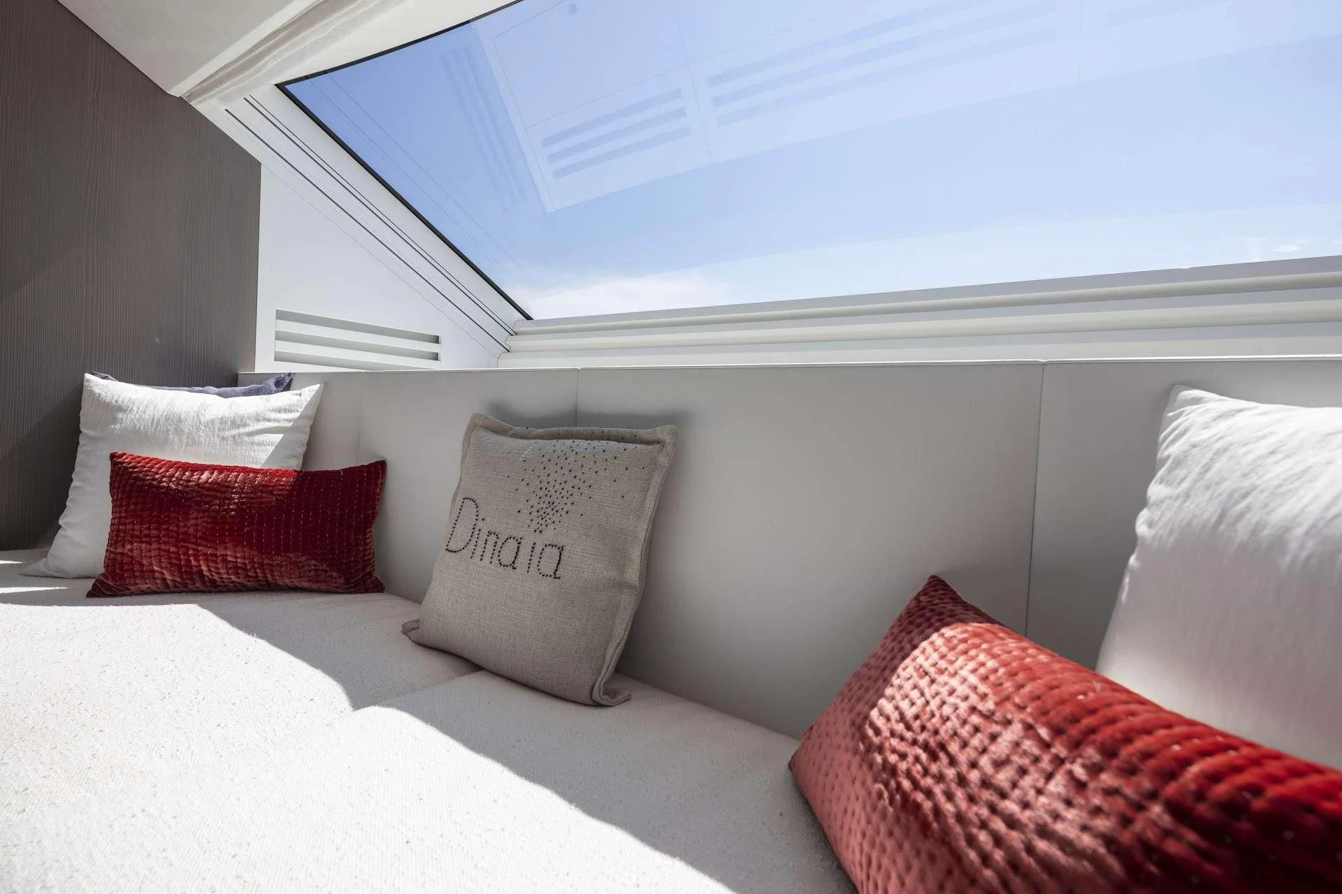 a bed with pillows aboard DINAIA Yacht for Charter