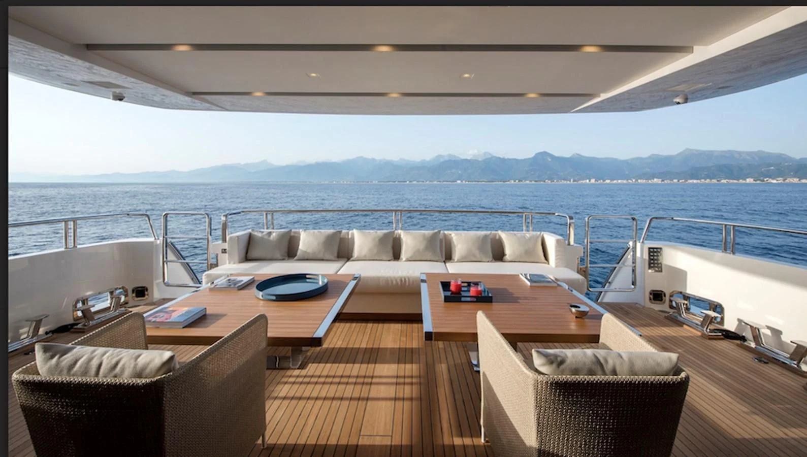 a living room with a large body of water aboard DINAIA Yacht for Charter