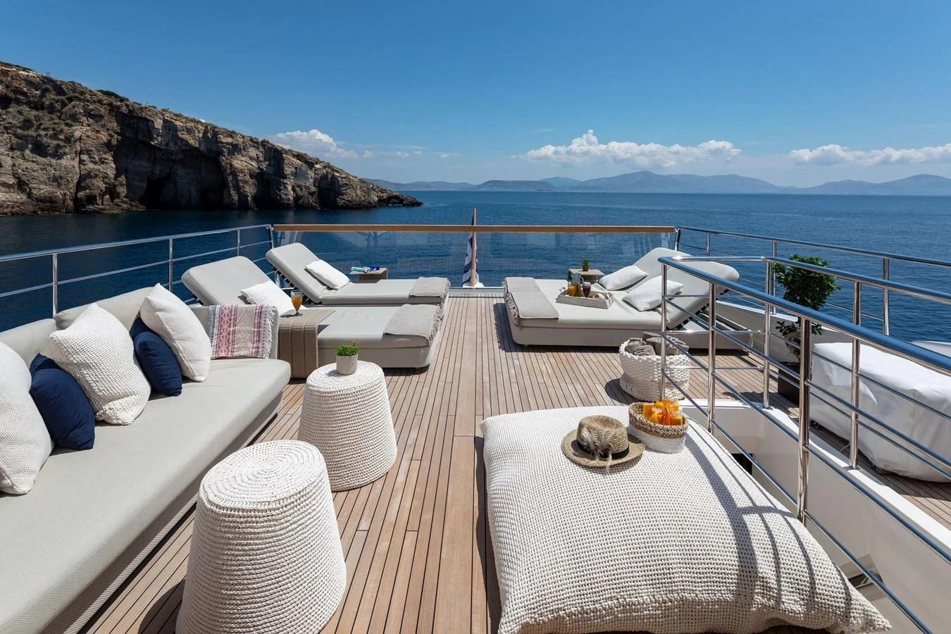 a balcony overlooking a large body of water aboard DINAIA Yacht for Charter