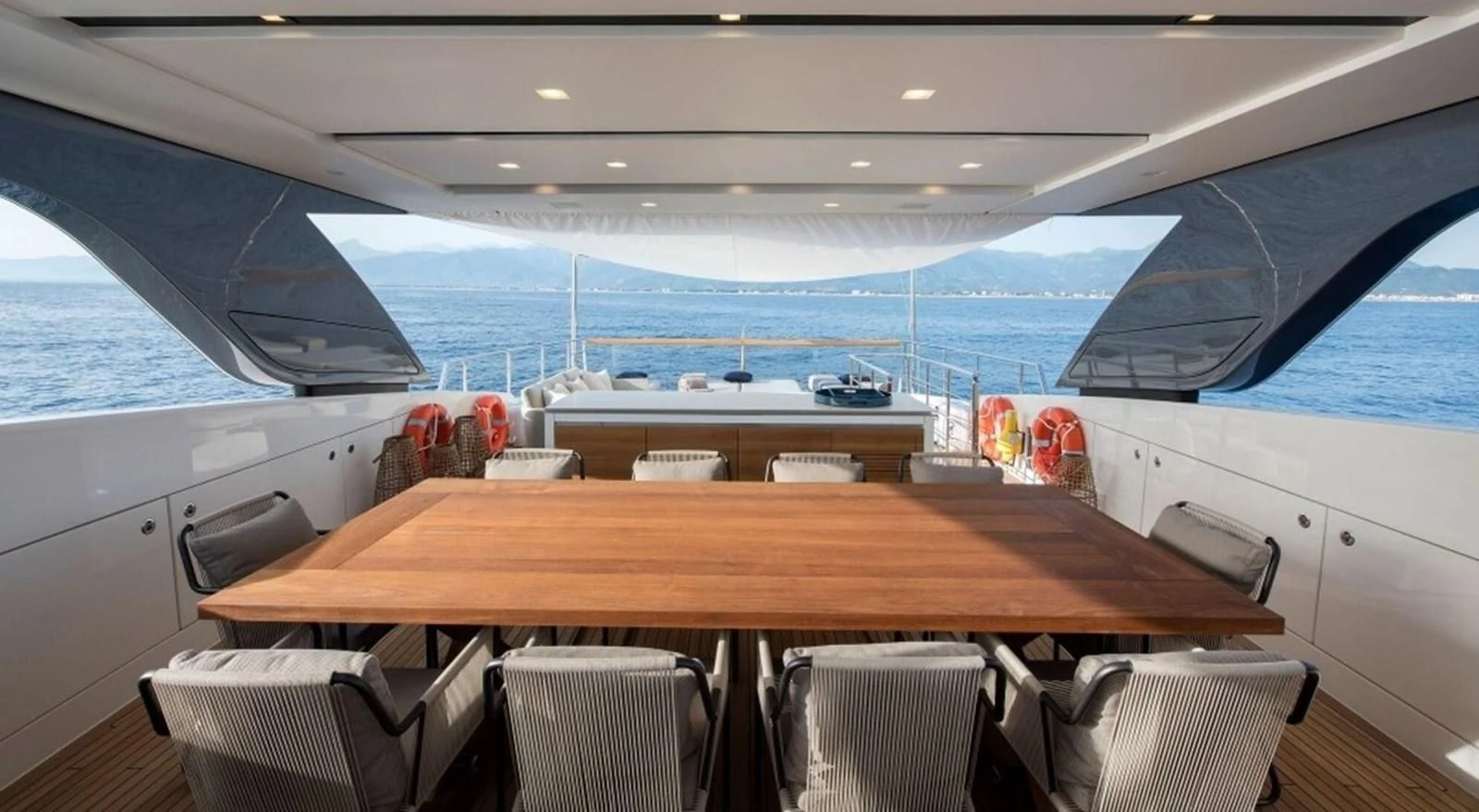 a boat with a table and chairs aboard DINAIA Yacht for Charter