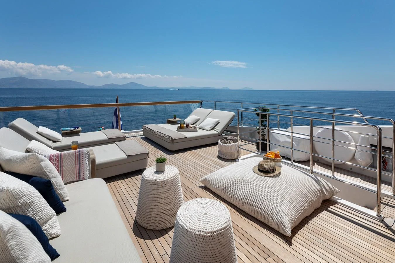a balcony overlooking the ocean aboard DINAIA Yacht for Charter