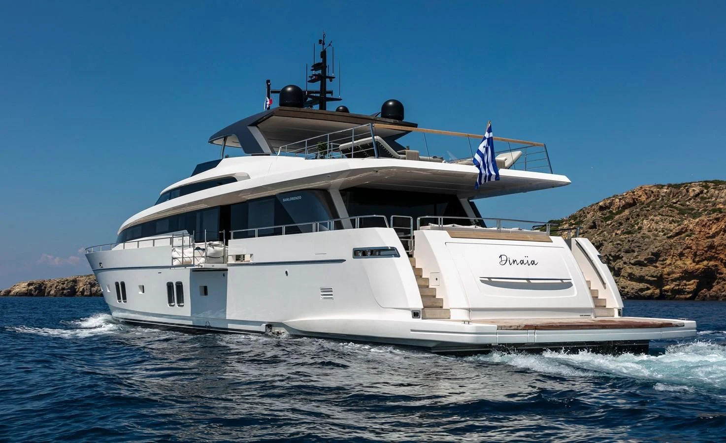 a white boat on the water aboard DINAIA Yacht for Charter