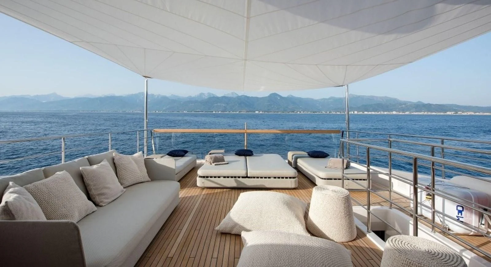 a large boat on a body of water aboard DINAIA Yacht for Charter