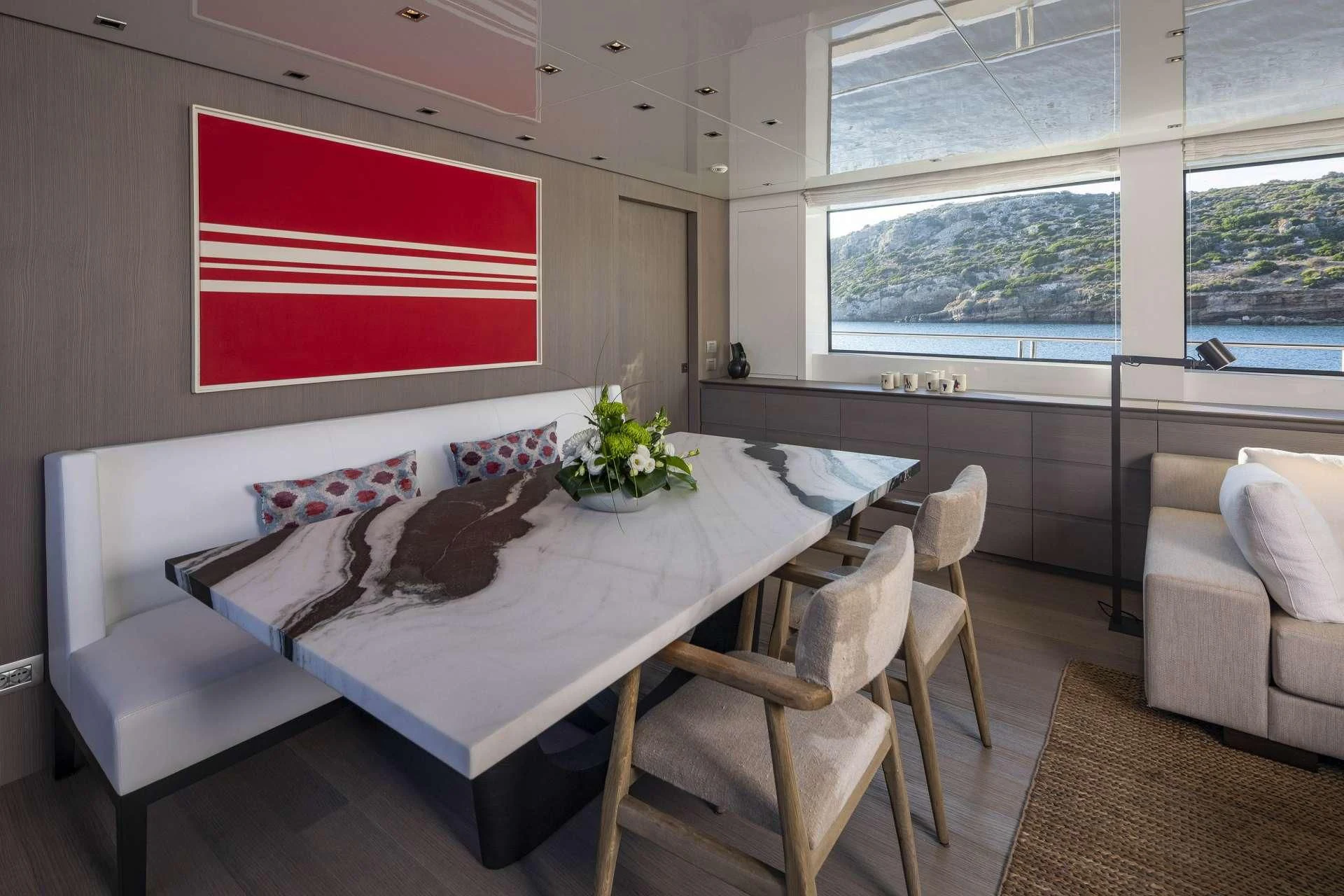a room with a couch and a table and chairs aboard DINAIA Yacht for Charter