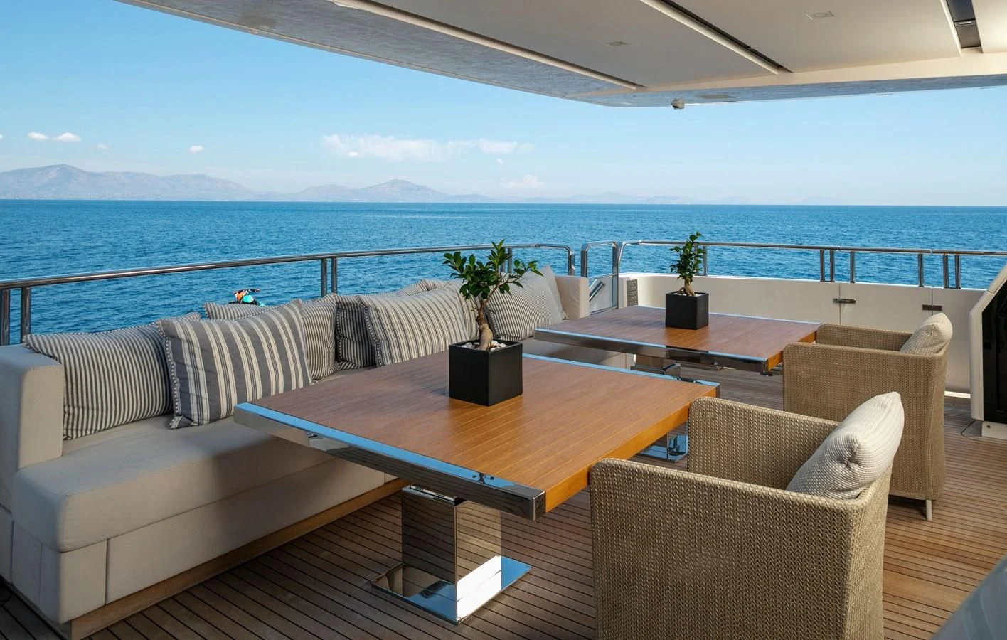 a living room with a table and chairs aboard DINAIA Yacht for Charter