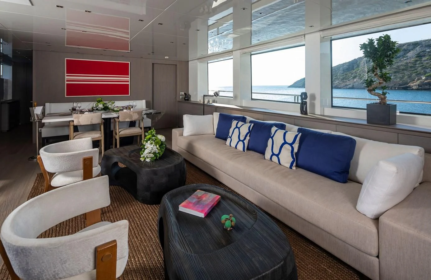 a living room with a couch and a table aboard DINAIA Yacht for Charter