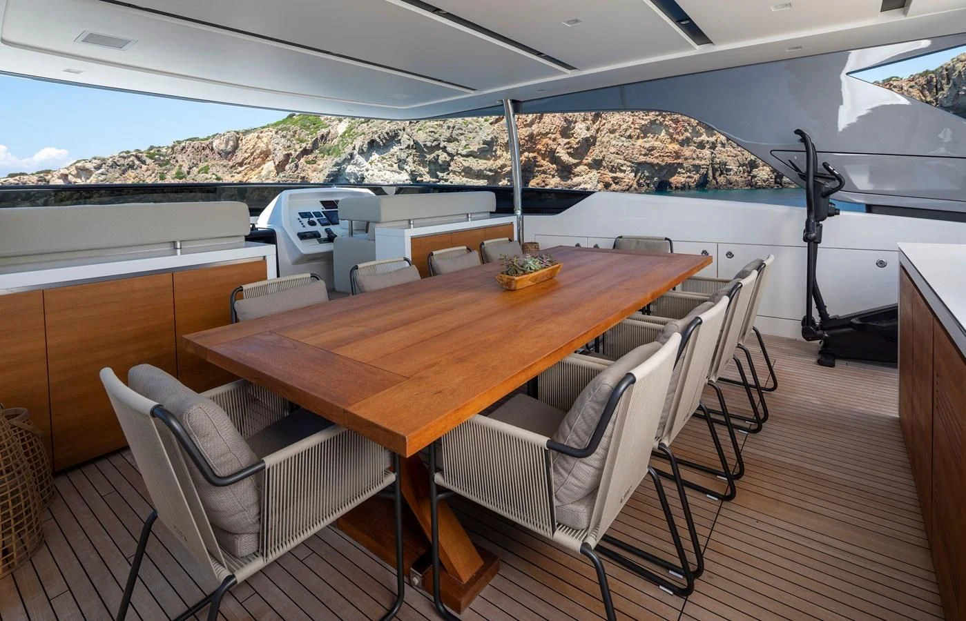a table with chairs on it aboard DINAIA Yacht for Charter
