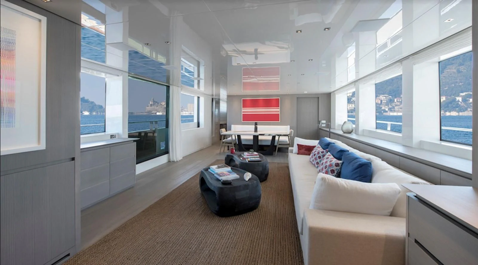 a living room with a large window aboard DINAIA Yacht for Charter