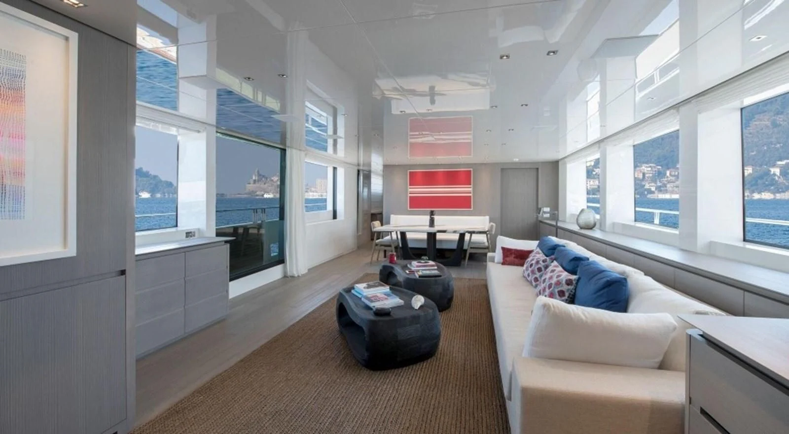a living room with a large window aboard DINAIA Yacht for Charter