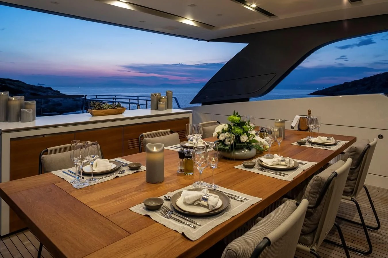 a table with plates and glasses on it aboard DINAIA Yacht for Charter