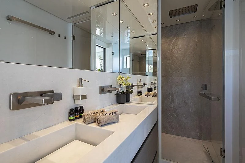 a bathroom with a large mirror aboard DINAIA Yacht for Charter