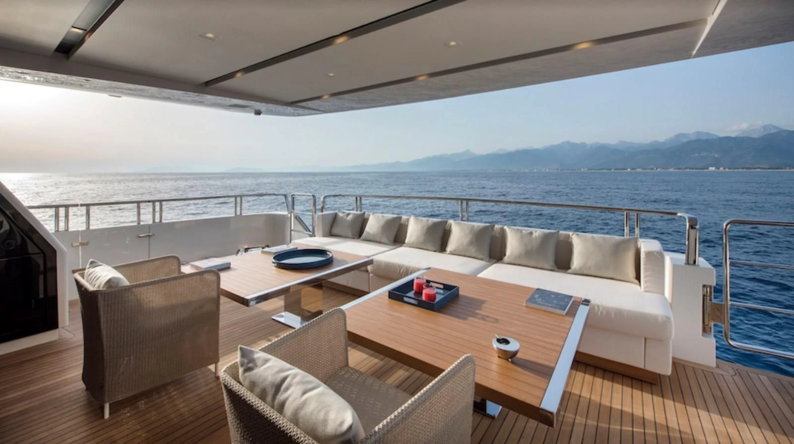 a living room with a large body of water aboard DINAIA Yacht for Charter