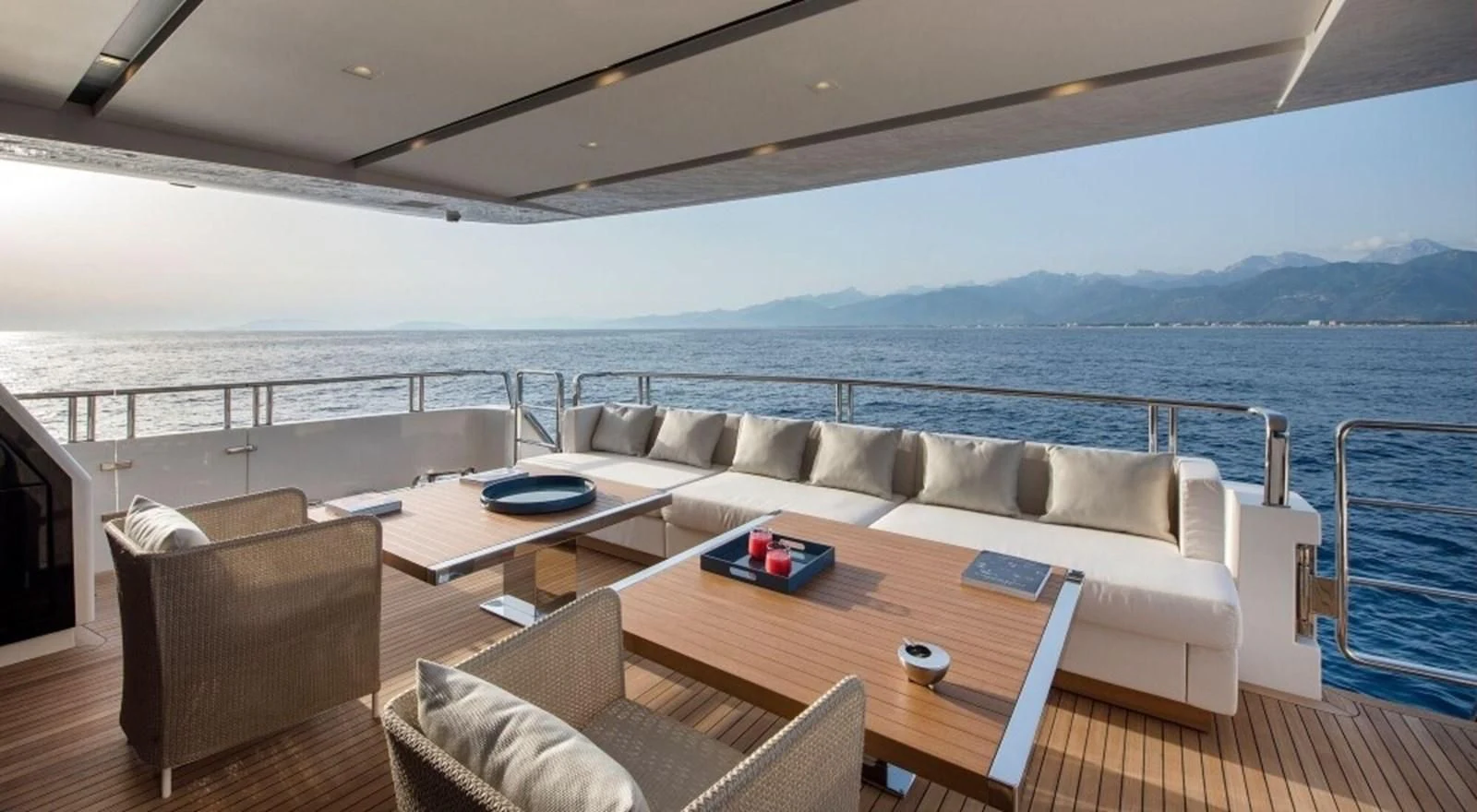 a living room with a large body of water aboard DINAIA Yacht for Charter