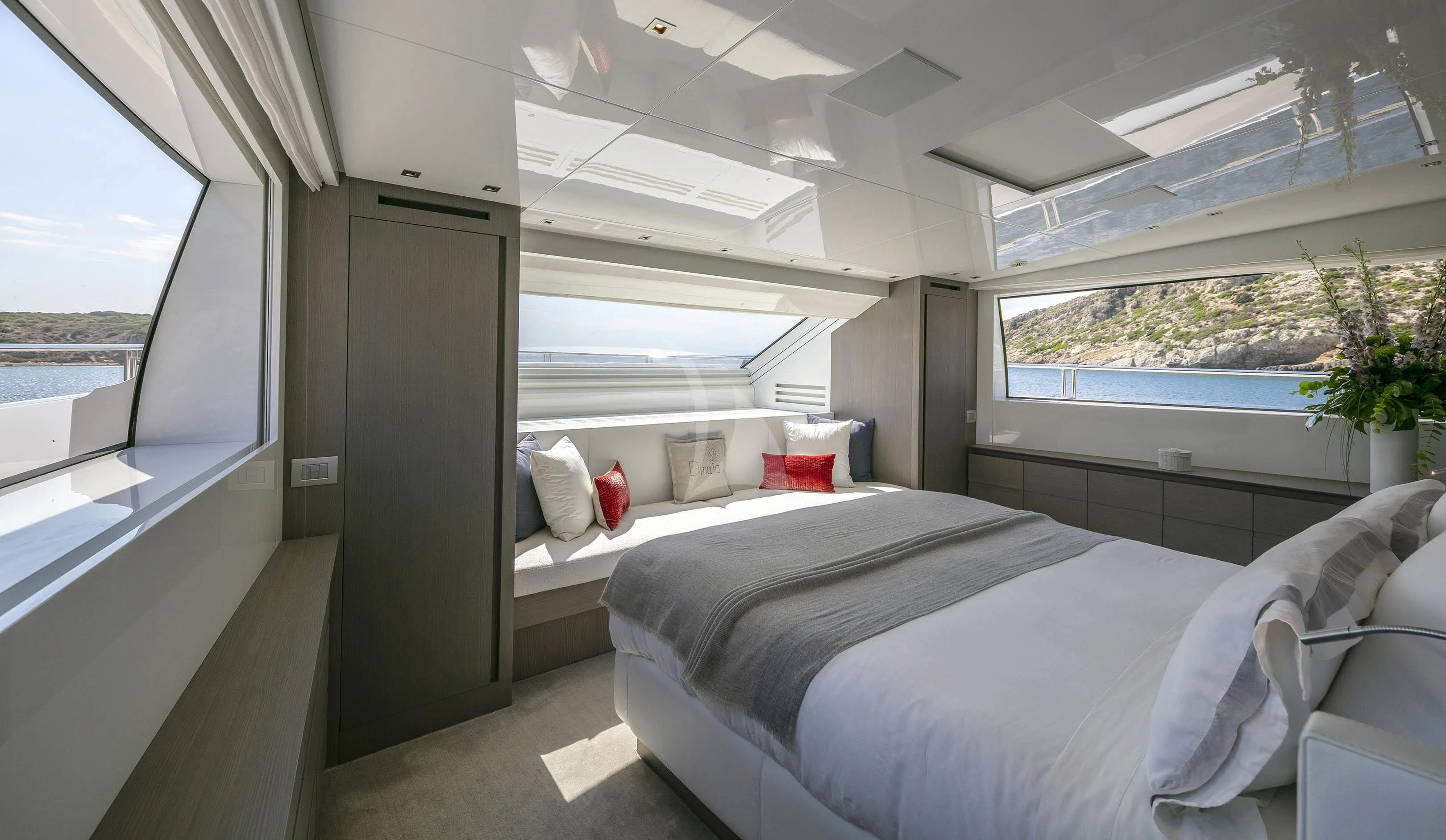 a room with a bed and a window aboard DINAIA Yacht for Charter