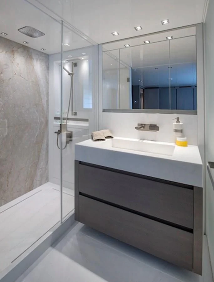 a bathroom with a large mirror aboard DINAIA Yacht for Charter