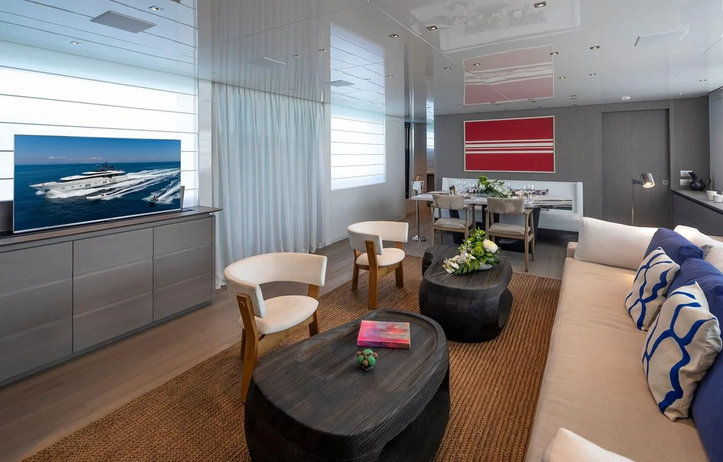 a living room with a large screen aboard DINAIA Yacht for Charter
