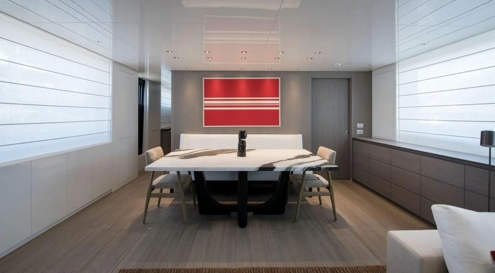 a room with a table and chairs aboard DINAIA Yacht for Charter