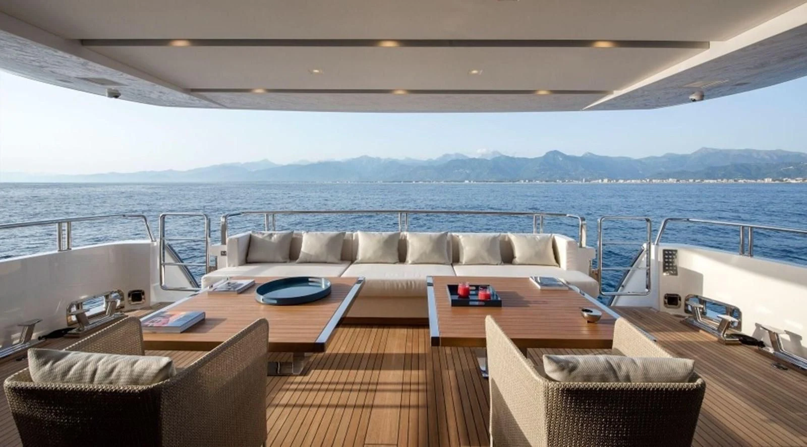 a large living room with a large body of water aboard DINAIA Yacht for Charter