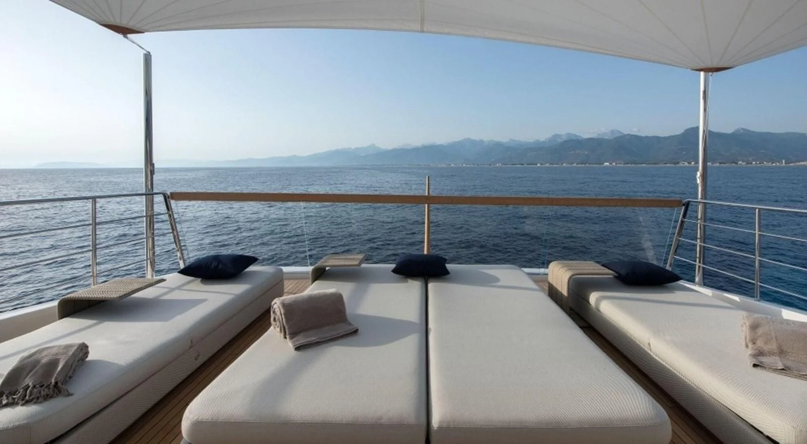 a boat with pillows on the deck aboard DINAIA Yacht for Charter