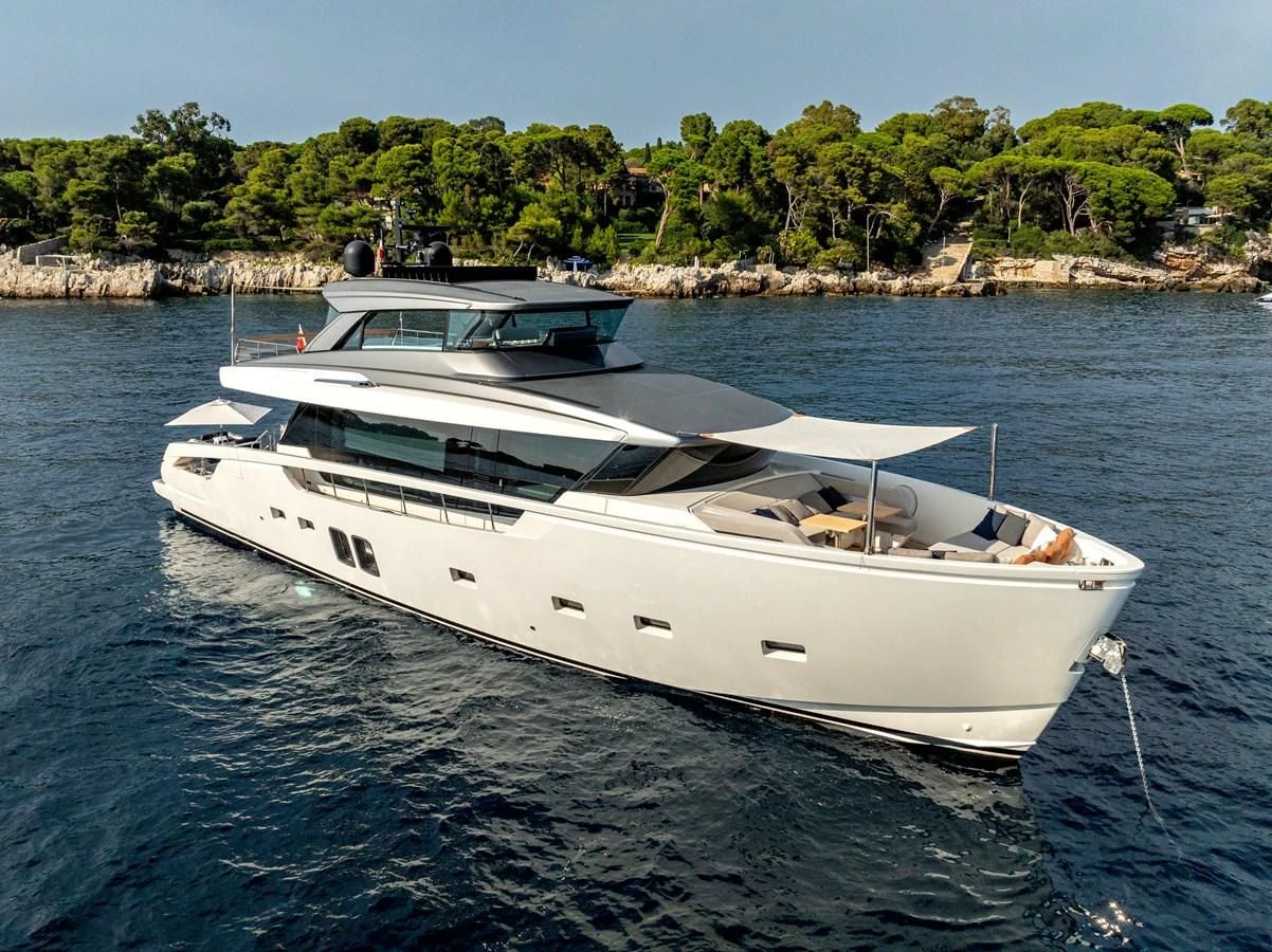 a white boat in the water aboard LOLA Yacht for Sale