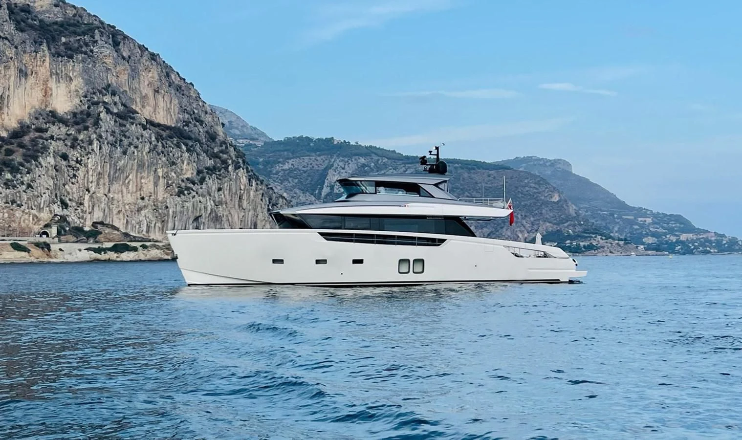 a white yacht in the water aboard LOLA Yacht for Sale