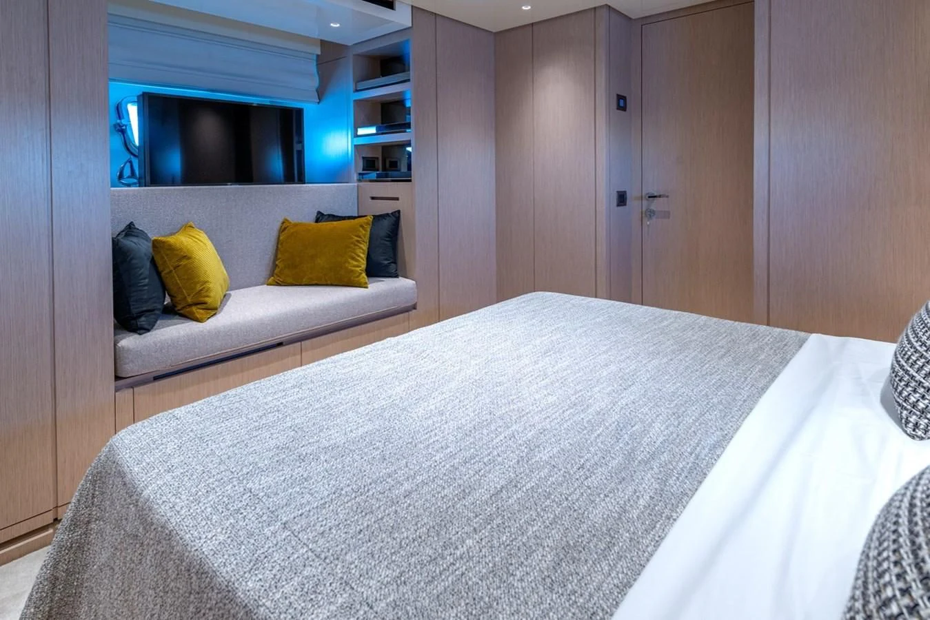 a bed in a room aboard LOLA Yacht for Sale